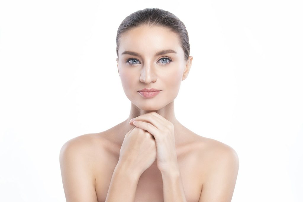 woman with clean perfect facial skin. Gestures for advertisement treatment spa and cosmetology.